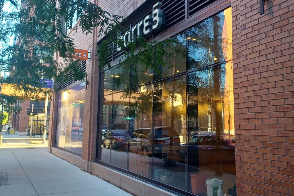 Entrance view of Barre3 studio with glass windows