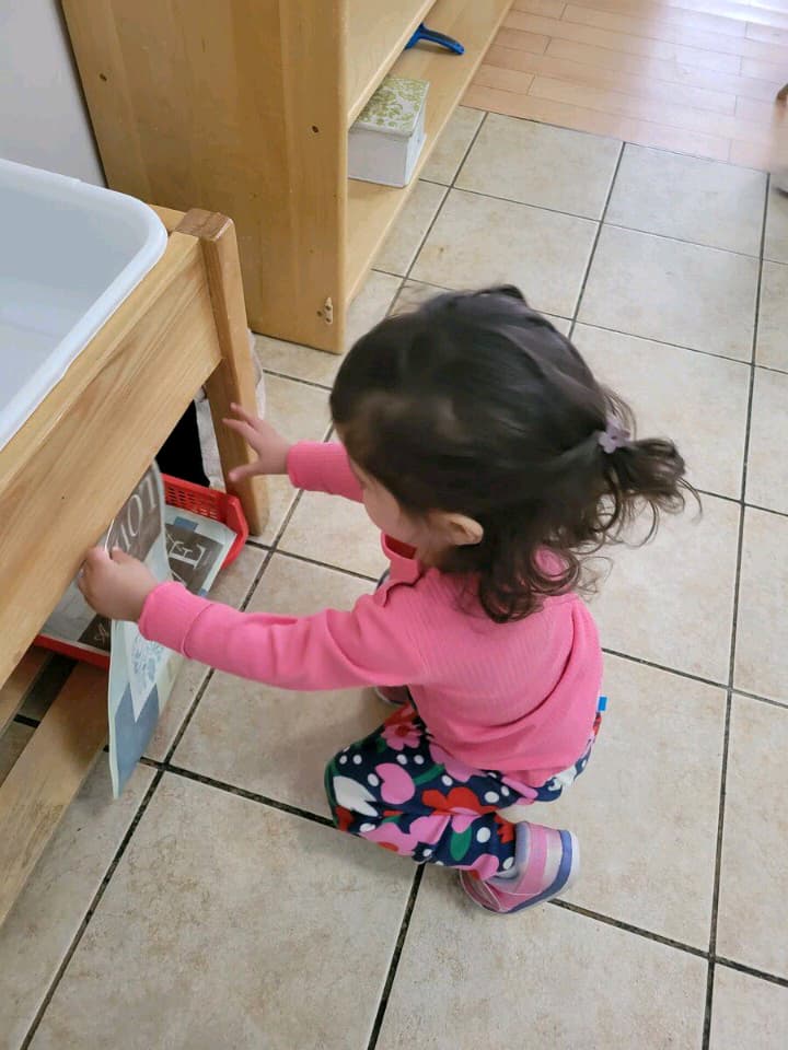 my toddler tidying up and organizing