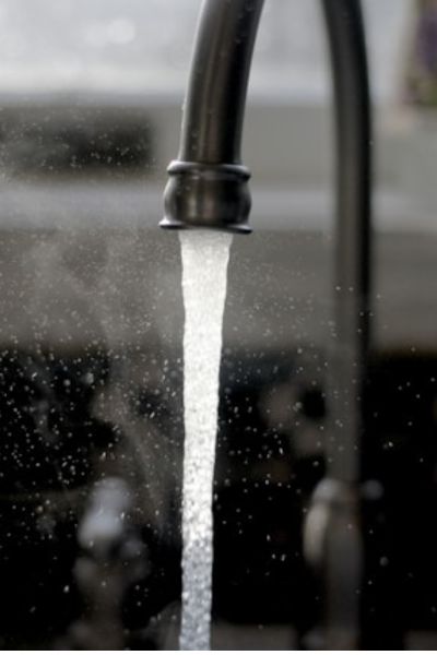 water running from a black faucet