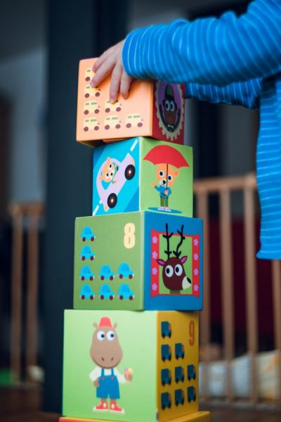 child stacking big blocks