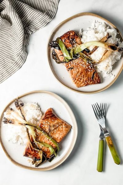 grilled salmon plated alongside potatoes and asparagus 